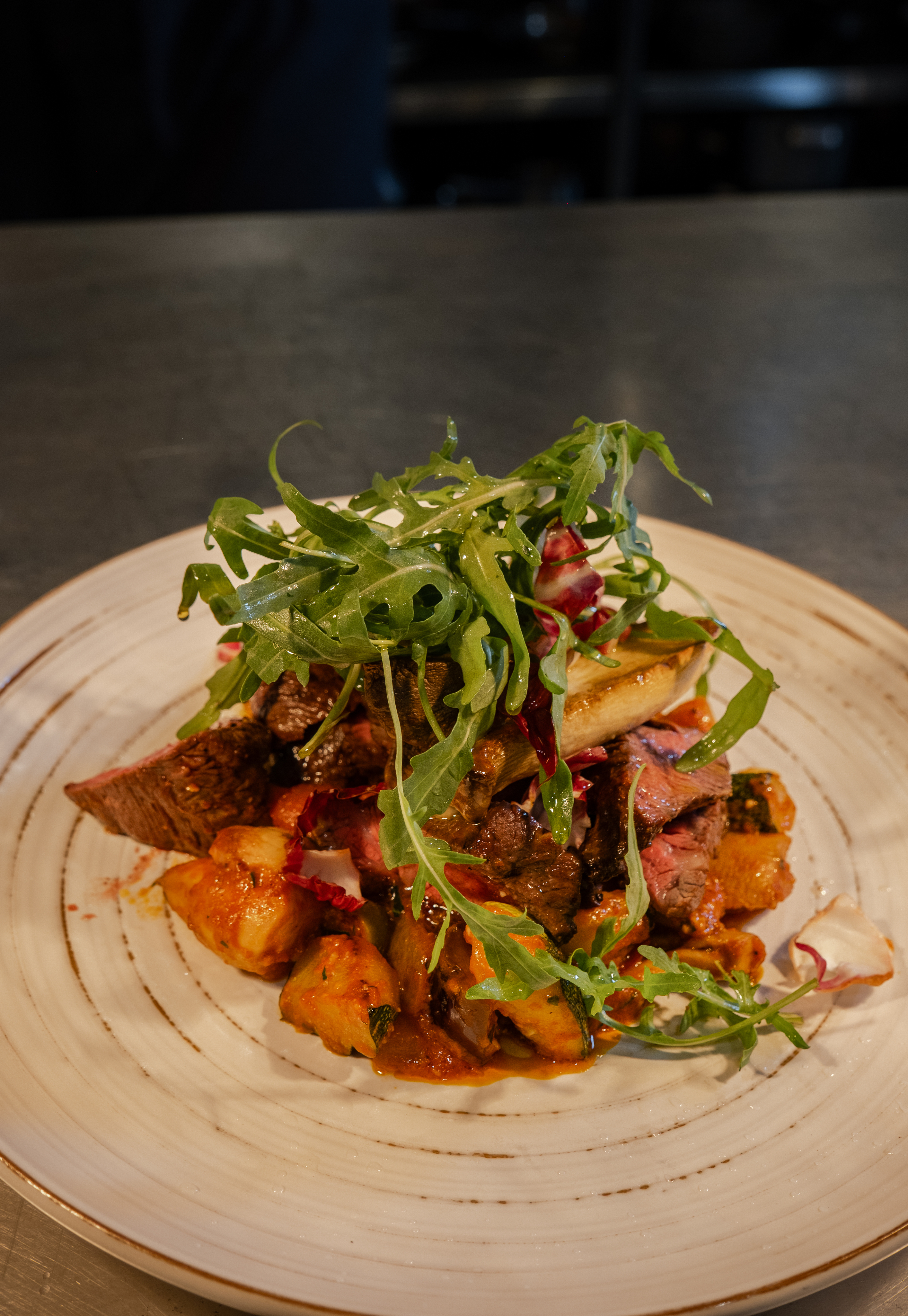 Fine dining steak with sauce and grilled vegetables at Iluka Restaurant Jeonju